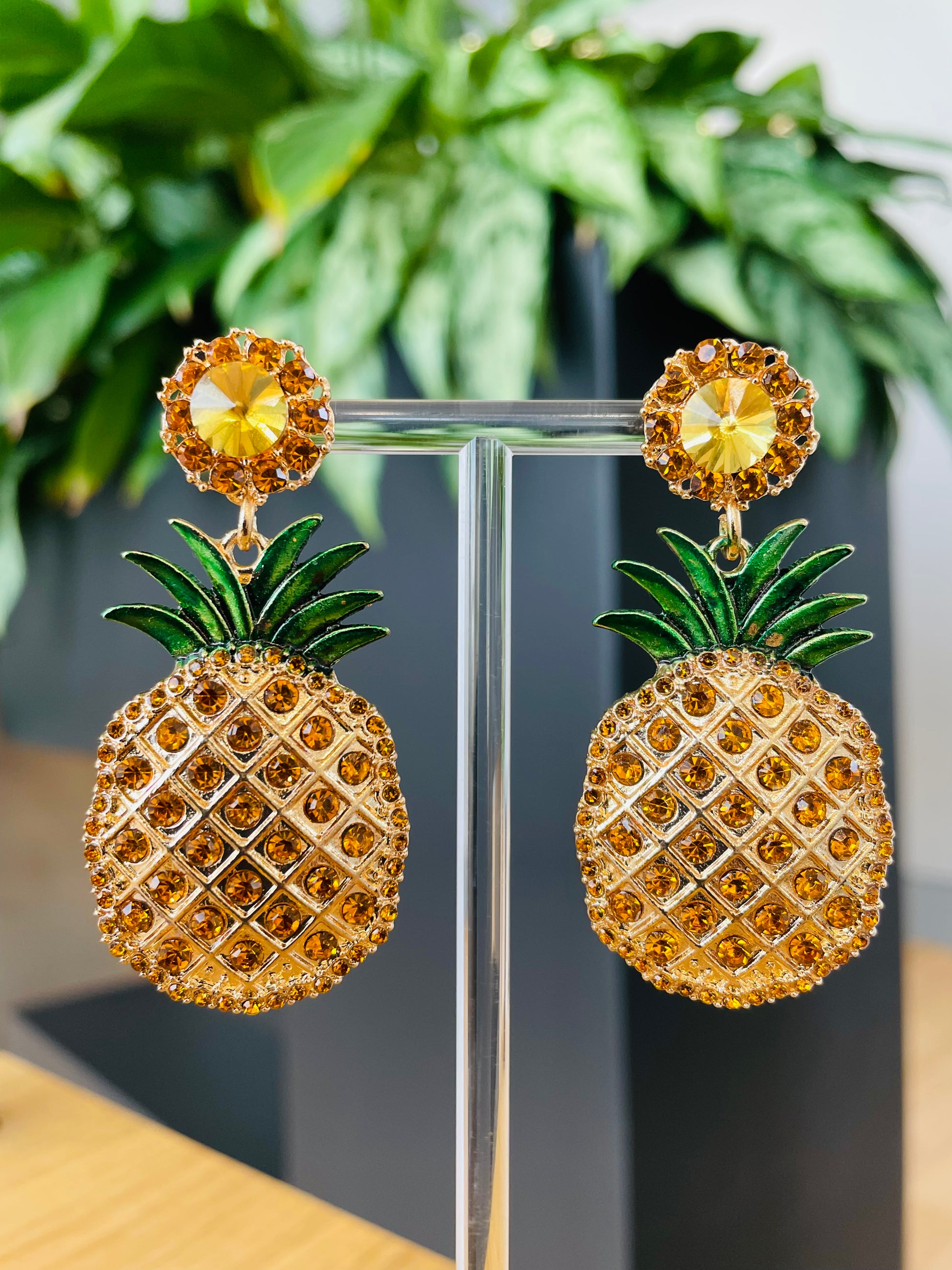 Playful pineapple-shaped earrings, gold-tone with intricate detailing, fun and tropical jewelry for summer fashion