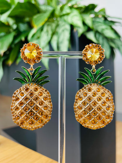 Playful pineapple-shaped earrings, gold-tone with intricate detailing, fun and tropical jewelry for summer fashion